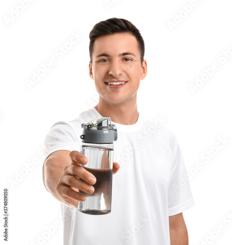 Sporty young man with bottl...