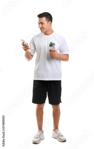 Sporty young man with bottl...