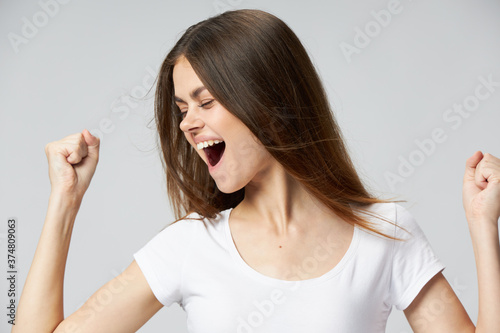 Wallpaper Mural Cheerful woman emotions open mouth white t-shirt closed eyes Torontodigital.ca