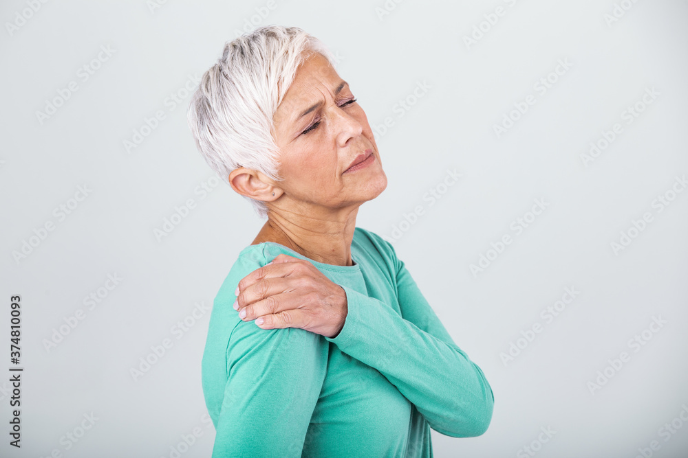 Senior woman with shoulder pain. Elderly woman is enduring awful ache