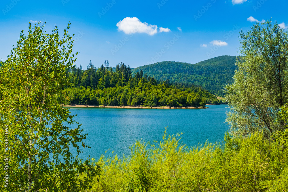 Landscape in Croatia, Gorski kotar, lake Lepenica, green forest and mountains in background