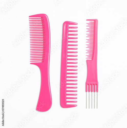 Pink hair combs on white background  top view