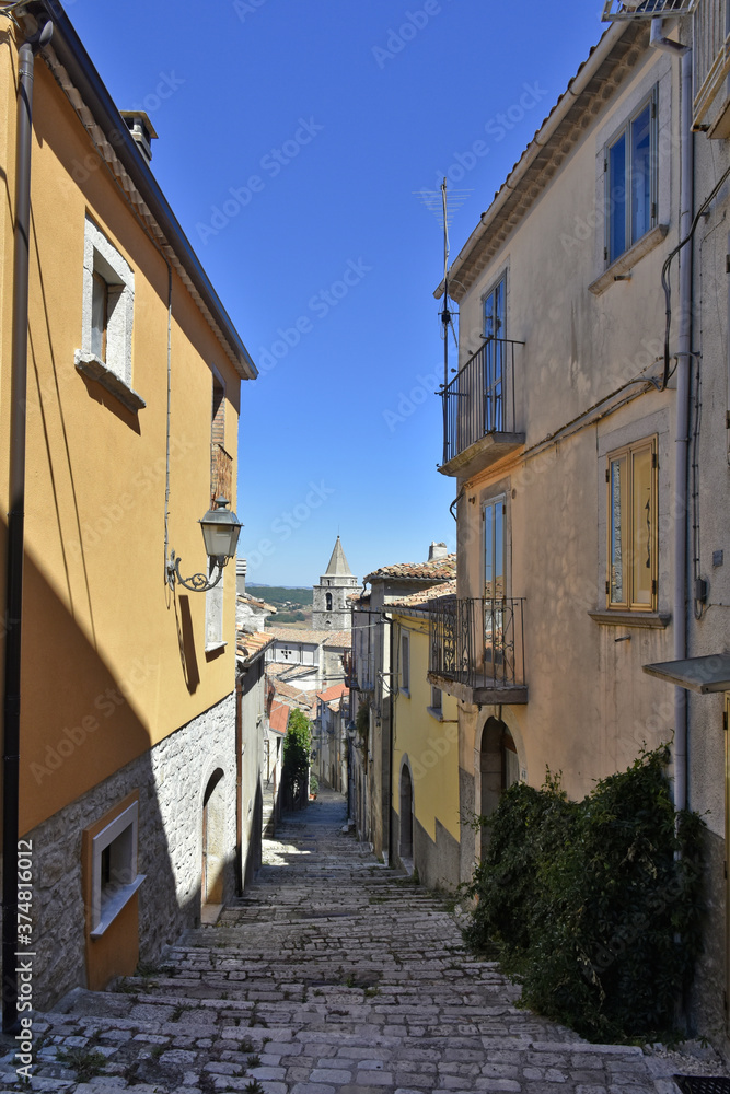 A narrow street among the old houses of Riccia, a medieval village in the Molise region.