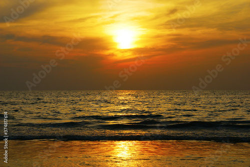 dramatic clouds. Sunset on a tropical island combined with sea and clouds in a dramatic sky