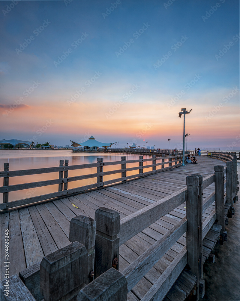 sunset on the pier, enjoying sunset at Ancol Beach 