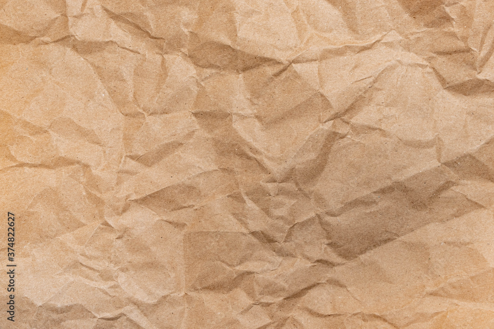 Close up of Recycled brown wrinkle crumpled old with paper page texture rough background. crease grunge parchment pattern vintage design Close up of Recycled brown wrinkle crumpled old with paper page texture rough background. crease grunge parchment pattern vintage design