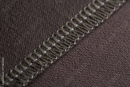 details of clothing, the seam is made on a sewing machine, the sections are processed with threads