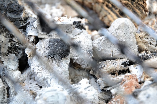 Grill with hot briquettes, close-up. Focus on the charcoal © PaulSat