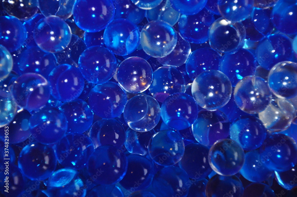 Blue jelly beads from a room fragrance device. Close-up image. abstract background with bubbles.