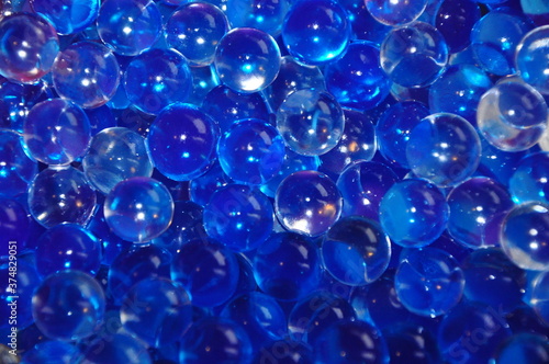 Blue jelly beads from a room fragrance device. Close-up image. abstract background with bubbles.