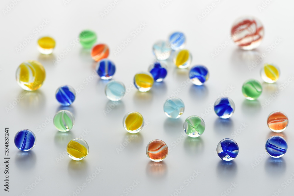 Colorful glass marbles on white background. Colorful glass marbles on white background.