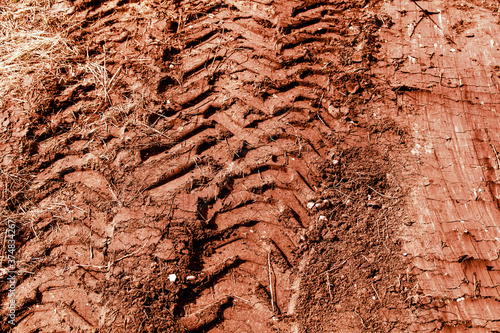 Traces of a truck on red soil. © schankz