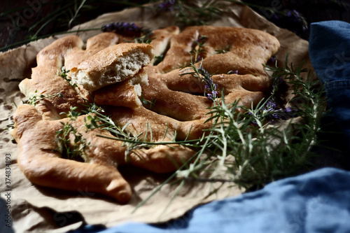 Fougasse, traditional french bread on wooden background. Selective focus