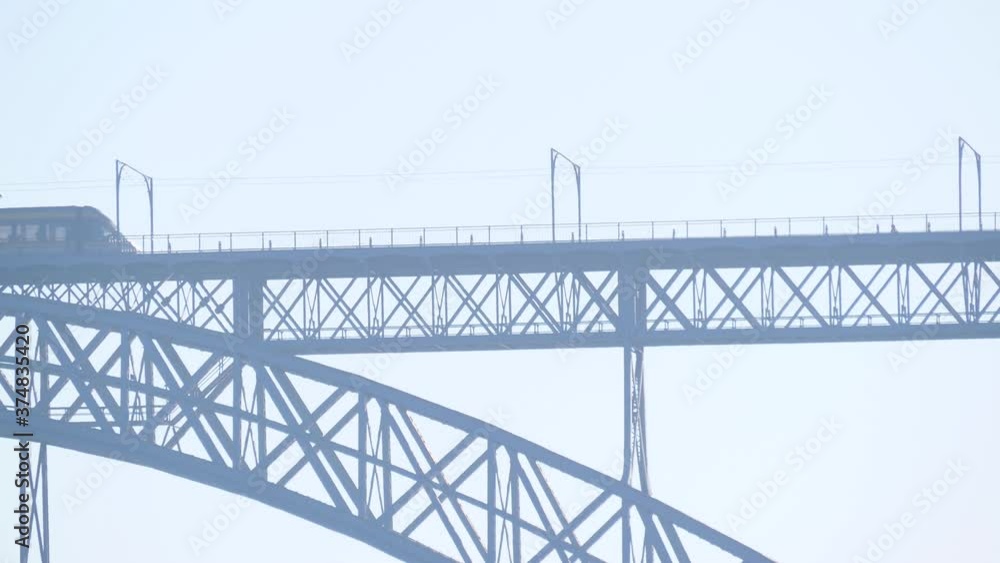 Metro train tram crossig metal bridge Dom Luis in porto portugal slow motion 4k Metro train tram crossig metal bridge Dom Luis in porto portugal slow motion 4k