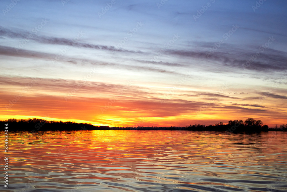 Colorful autumn sunset over the Danube river