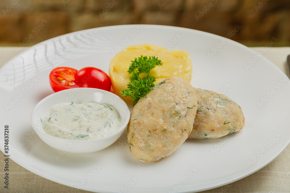 Hot cutlets with mashed potatoes and sauce. Hot cutlets with mashed potatoes and sauce.