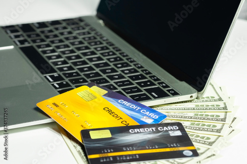 Online shopping with credit card and laptop, internet payment with credit card.