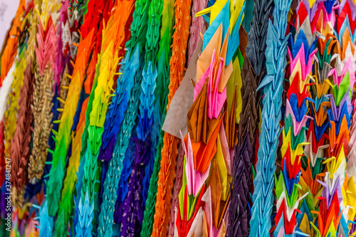 Colorful traditional one thousand Japanese origami paper cranes © TravelWorld