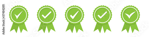 Set of green approved or certified medal icons in a flat design