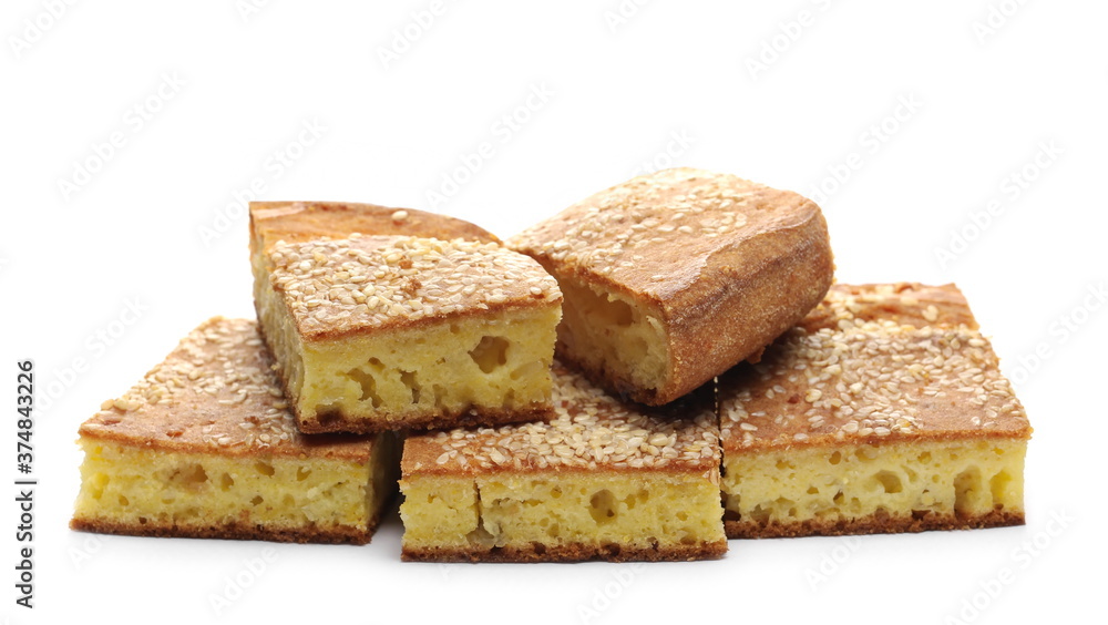 Cornbread slices with sesame seeds, traditional breakfast pastry isolated on white background