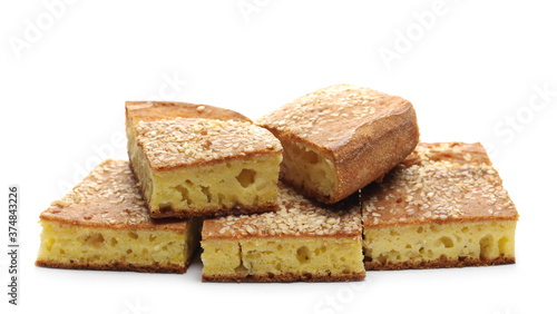 Cornbread slices with sesame seeds, traditional breakfast pastry isolated on white background