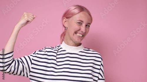 happy young woman showing her pretty hand photo