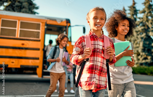 Children near school bus © Vasyl