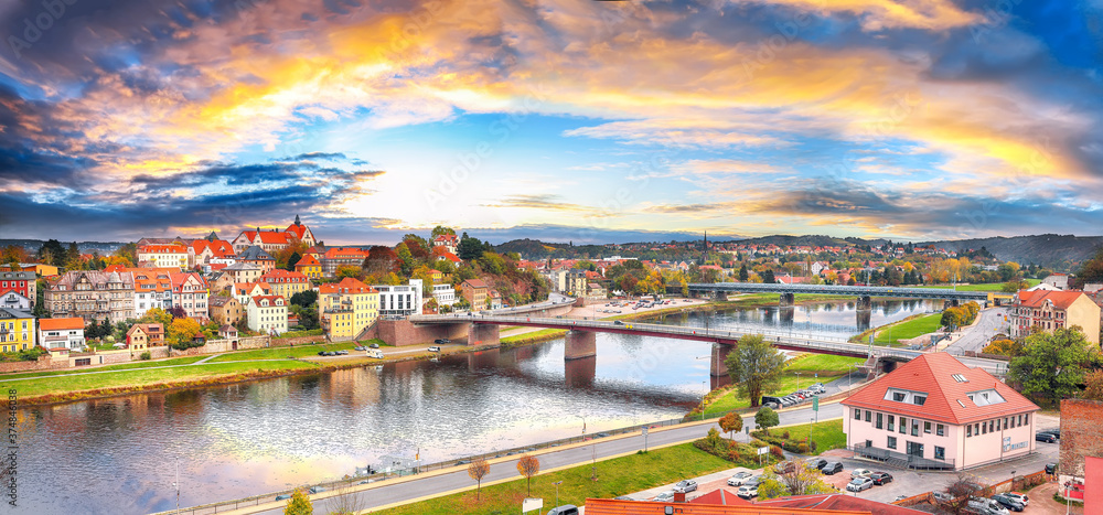 Fantastic sunset view on cityscape of Meissen town on the River Elbe.