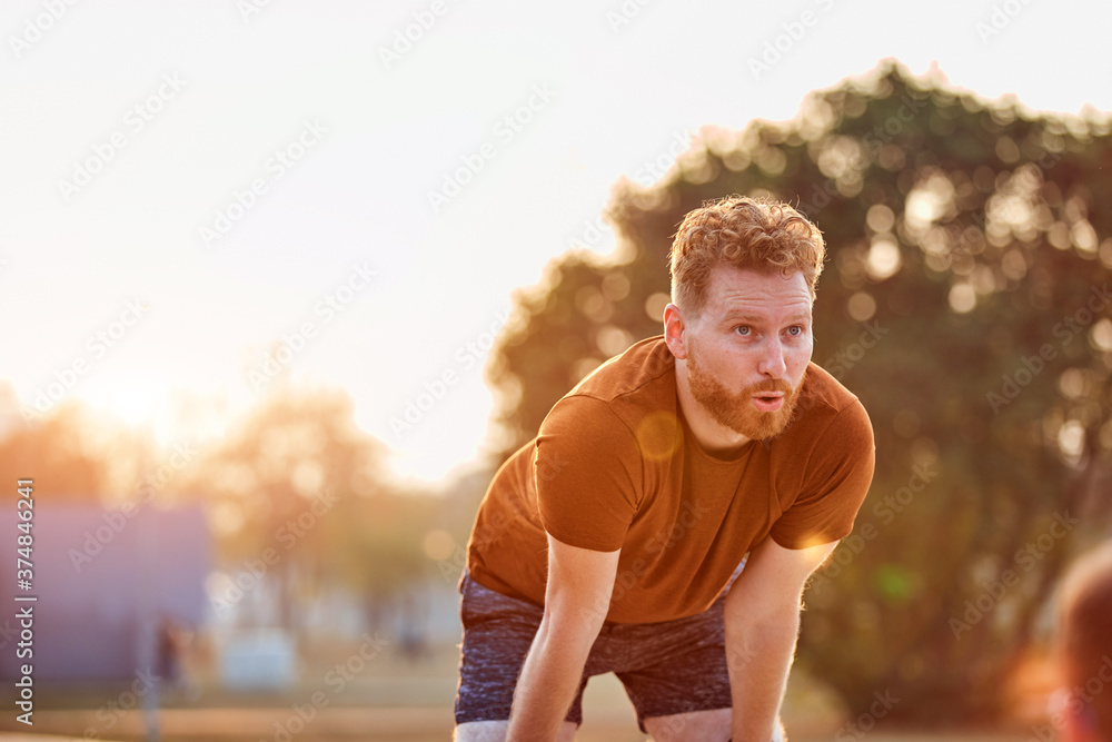 Modern young man working out in an urban park. Modern young man working out in an urban park.