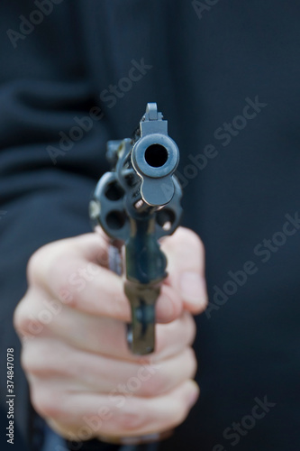 Close up of a pistol gun in the hand of a man