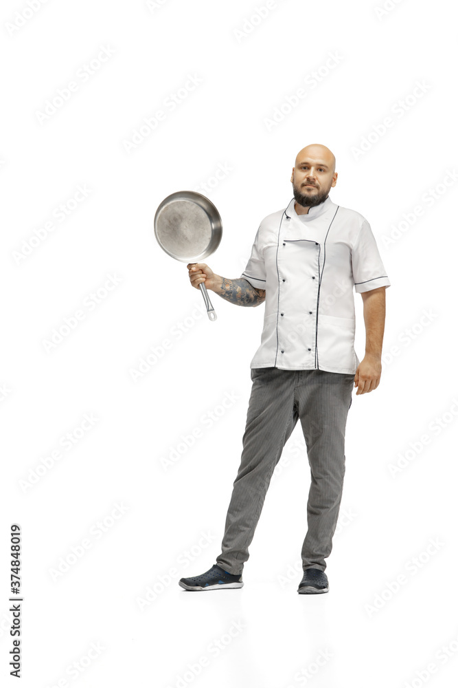 Portrait of a male chef cook, butcher isolated on a white studio background. Concept of professional occupation, work, job, food and restaurant industry. Caucasian man with kitchen utensils. Portrait of a male chef cook, butcher isolated on a white studio background. Concept of professional occupation, work, job, food and restaurant industry. Caucasian man with kitchen utensils.