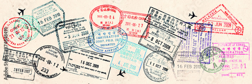 Passport visas stamps on sepia textured, vintage travel collage panoramic background and web banner