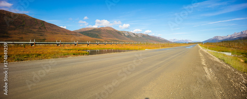 Landscape with mountains and the Dalton highway in north Alaska in the vicinity of Wiseman