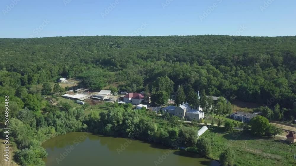 Aerial view of christian monastery. The lake and a view of the Thiganeshty Monastery. Moldova. Aerial view of christian monastery. The lake and a view of the Thiganeshty Monastery. Moldova.