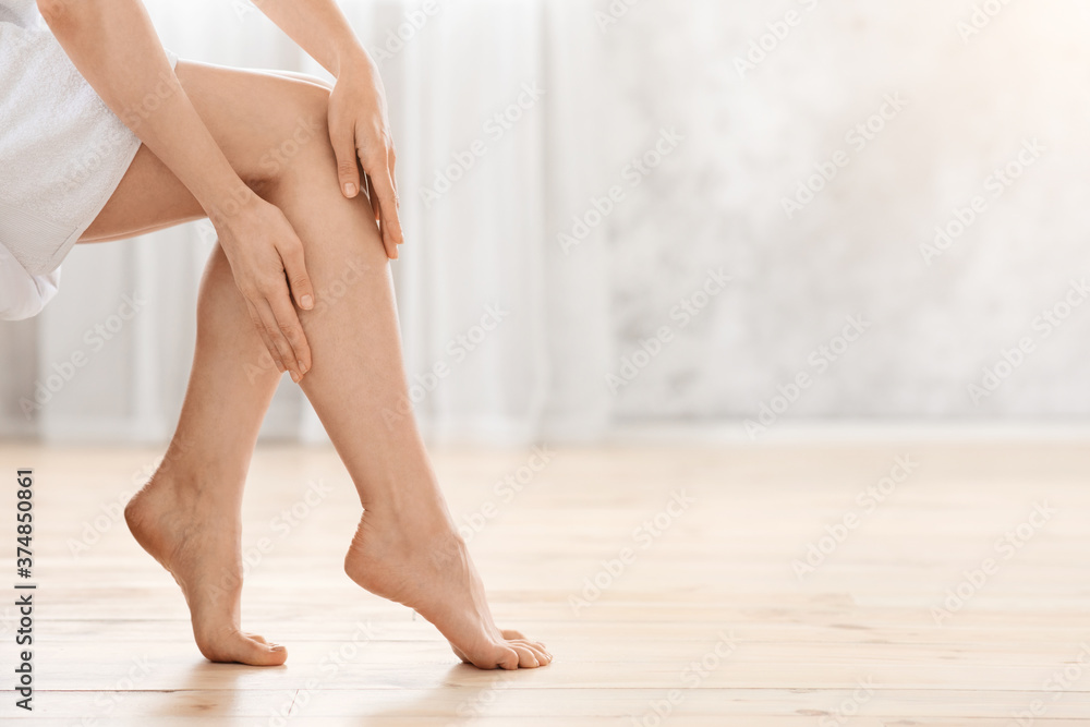 Closeup of female legs, woman enjoying her silky skin