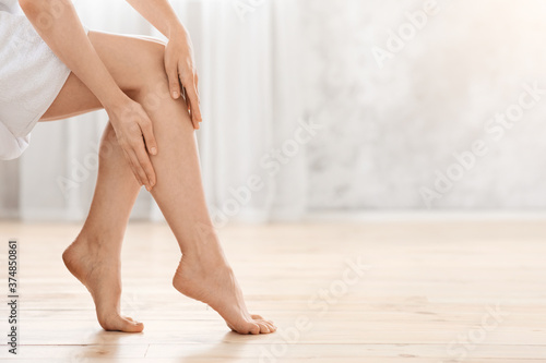 Closeup of female legs, woman enjoying her silky skin © Prostock-studio