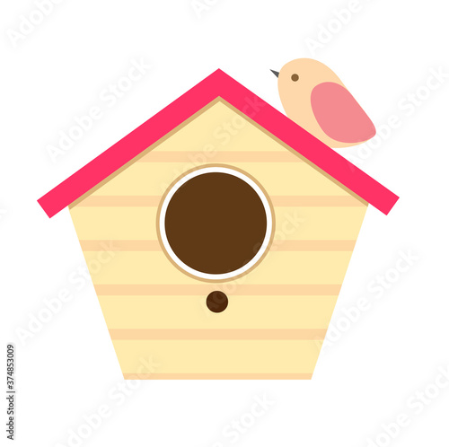 Wooden birdhouse with bird sitting on it