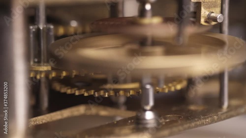 old clock mechanism with metal gears macro shot slow motion 4k