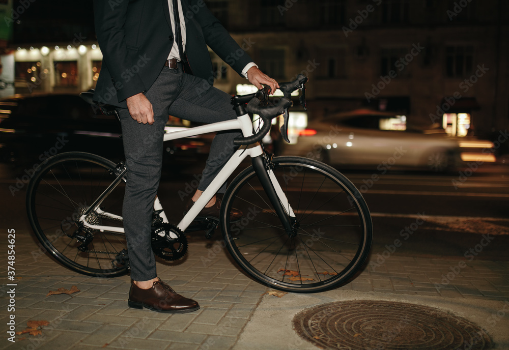 Crop manager riding bike at night