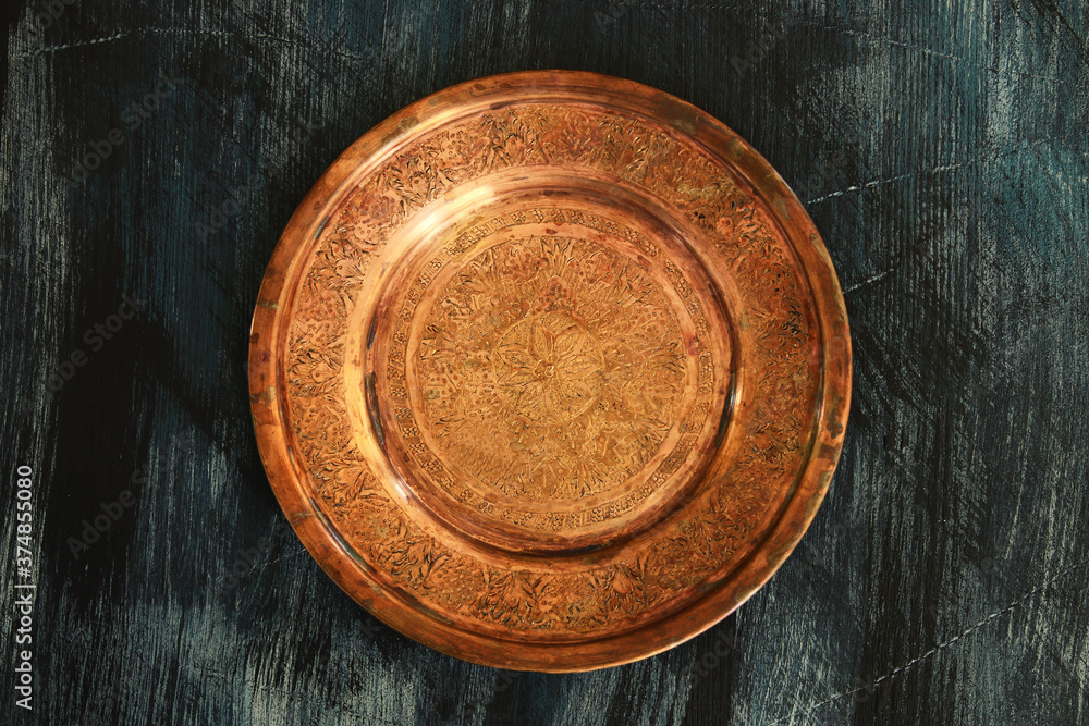 Empty plate over black wooden background. Top view with clipping path Empty plate over black wooden background. Top view with clipping path