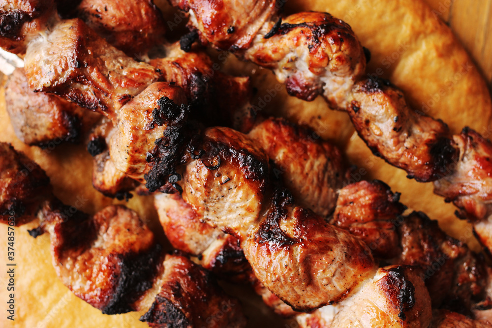 pork skewers on a wooden table pork skewers on a wooden table