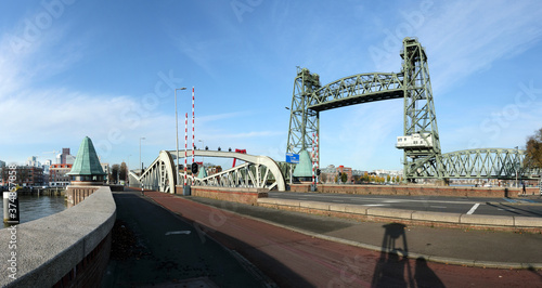 Rotterdam, Netherlands: "De Hef" or Kings Harbour Bridge, an old railway lift bridge, now a monument out of operation; in front the Queens bridge for road traffic