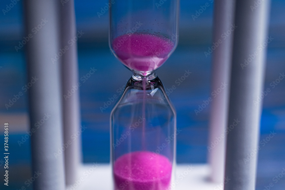 hourglass on a blue background. close-up hourglass on a blue background. close-up
