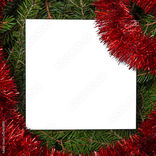 Empty Christmas cards or wish list on fir branches with Christmas decorations