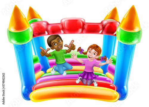 Children jumping and bouncing on a kids bouncy inflatable castle house