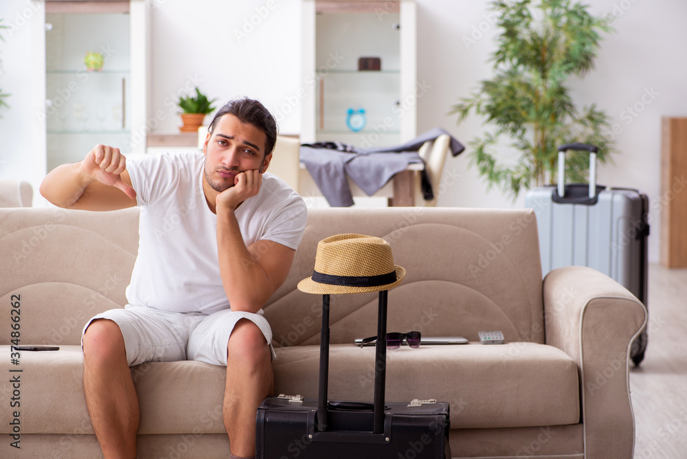Young man preparing for departure at home Young man preparing for departure at home