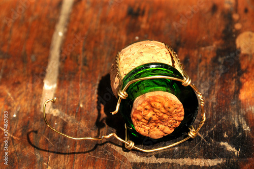 The top of a sparkling wine bottle after it has been cut off with a sabre
