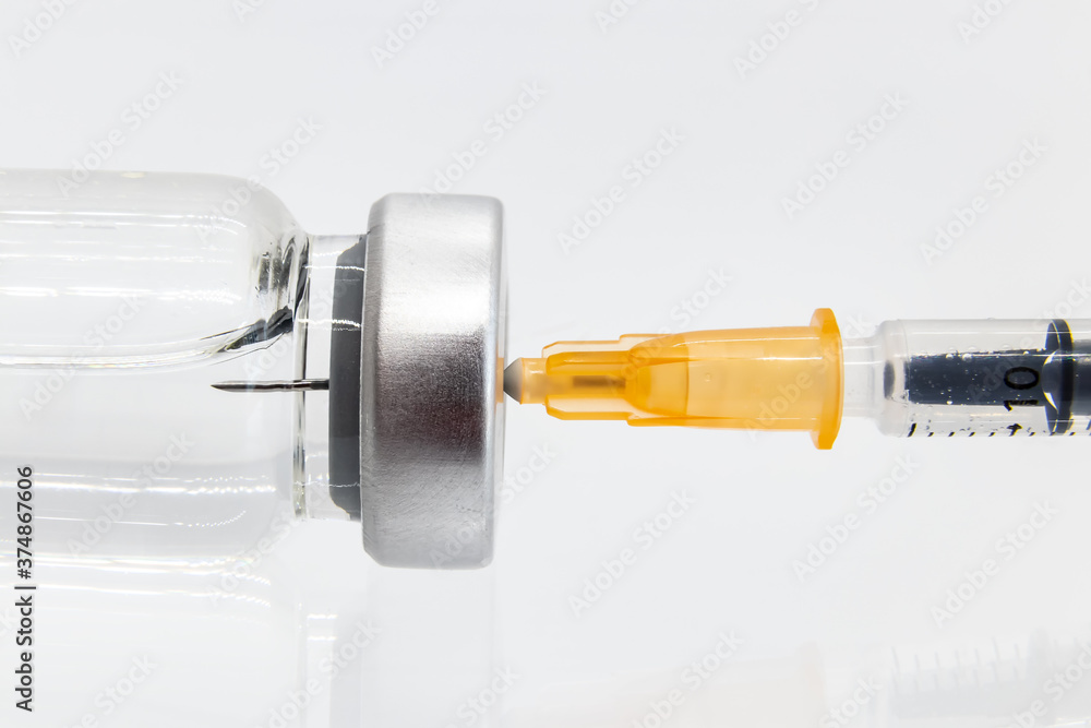 Vaccine in vial with syringe isolated on white background Vaccine in vial with syringe isolated on white background