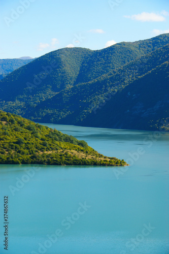 Mountain Lake. blue water of a quiet lake surrounded by mountains