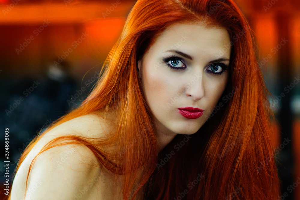 beautiful red-haired girl in the garage